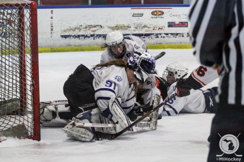 Alex LaRue (No. 91) makes a save during the girls' high school hockey showcase in Fraser. (Photo by Michael Caples/MiHockey)