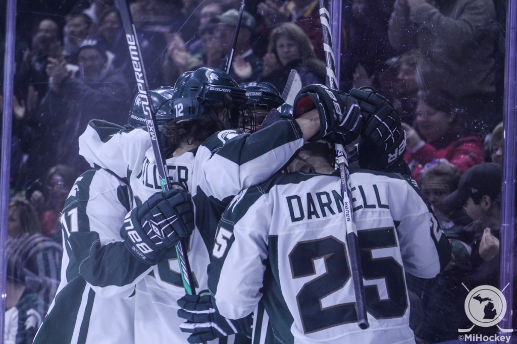 Click on the image above to see MiHockey's photo gallery from Friday night's win. (Photo by Michael Caples/MiHockey)