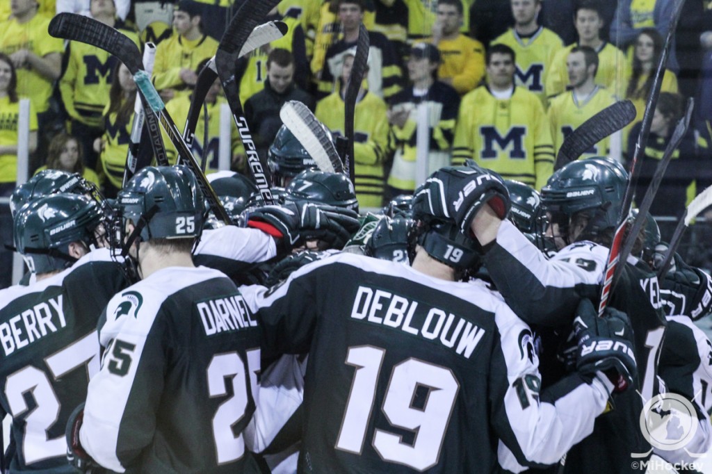 The Spartans celebrate their win over the Wolverines at Yost. (Photo by Michael Caples/MiHockey)