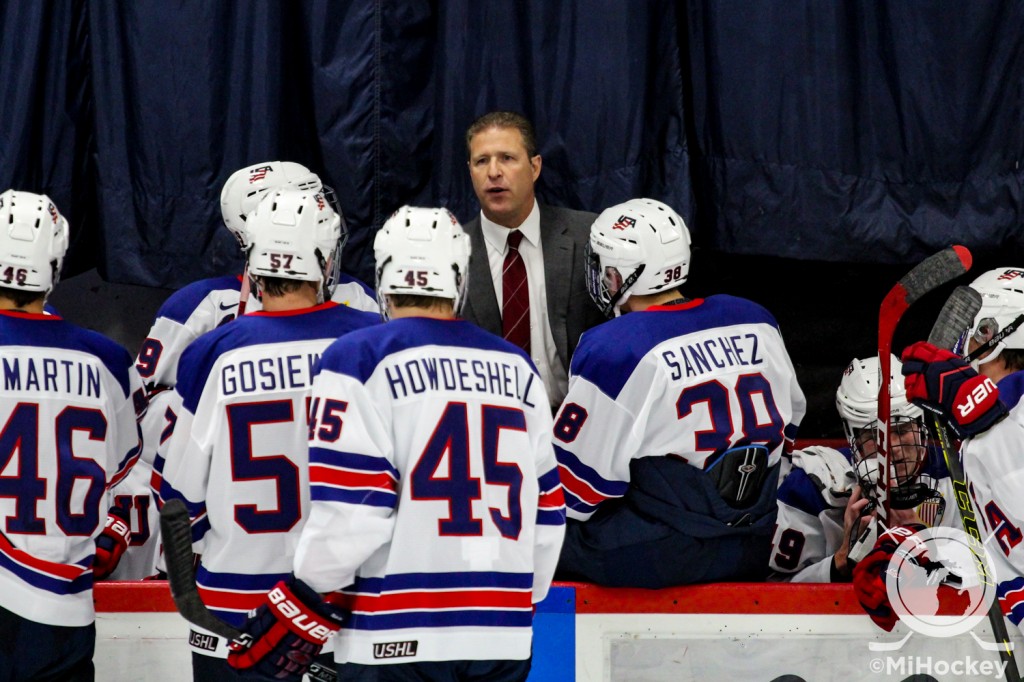 NTDP head coach Danton Cole talking to his players between period of a game at the Ann Arbor Ice Cube last season. (Photo by Michael Caples/MiHockey)