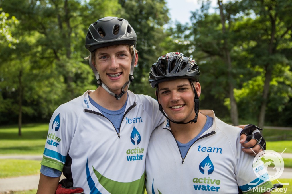 Portage Central goaltender Alex Hufford and his friend Max Newsome during their bike trip across Michigan to raise money for construction of a well in Cambodia. (Photo by Michael Caples/MiHockey)