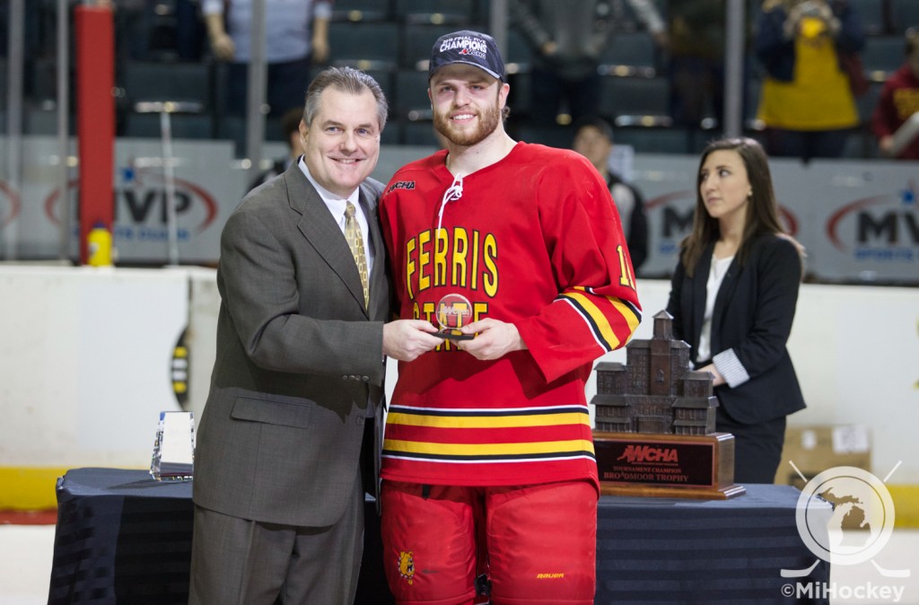 Kenny Babinski accepts his award after being named to the WCHA Final Five All-Tournament Team. (Photo by Michael Miller/MiHockey)