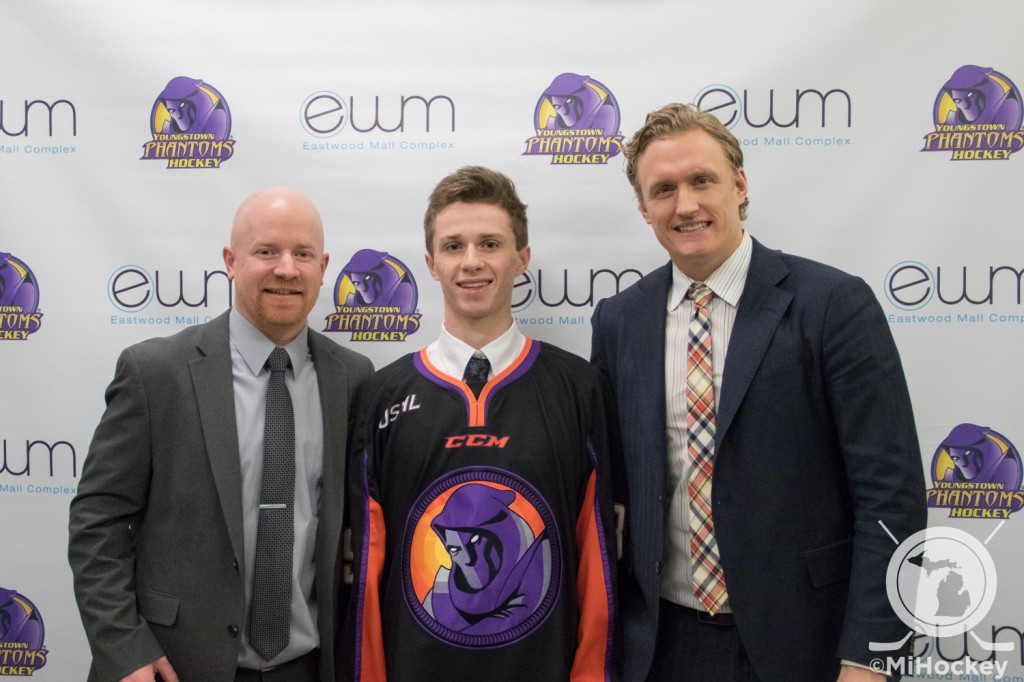 Max Ellis (middle) poses for a photo with Youngstown Phantoms general manager Jason Koehler and head coach John Wroblewski. (Photo by Michael Caples/MiHockey)