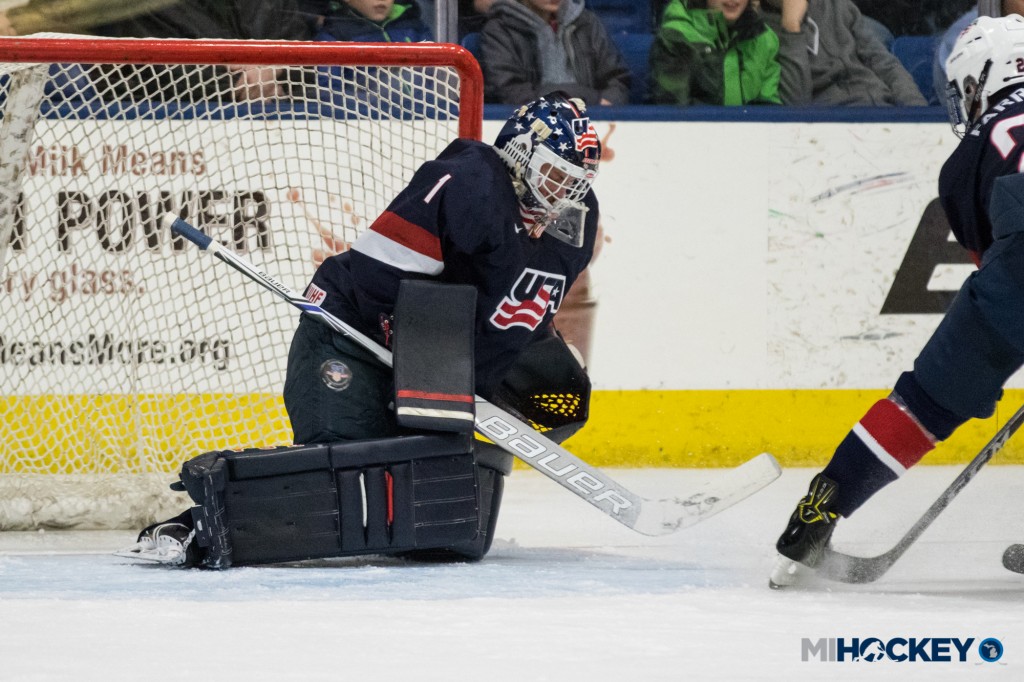 One of St. Cyr's 24 saves on Friday in a win against Green Bay. (Photo by Michael Caples/MiHockey)